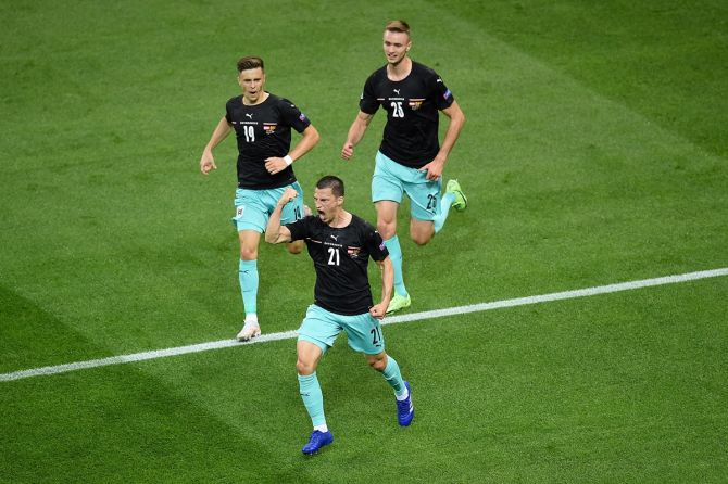 Stefan Lainer celebrates after scoring Austria's first goal during the Euro 2020 Group C match against North Macedonia, at National Arena Bucharest, on Sunday.