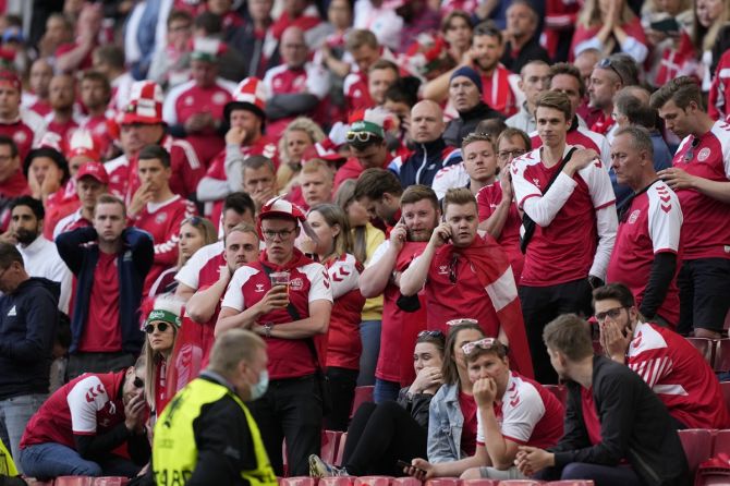 Denmark fans watch in disbelief as Christian Eriksen receives medical attention on the ground