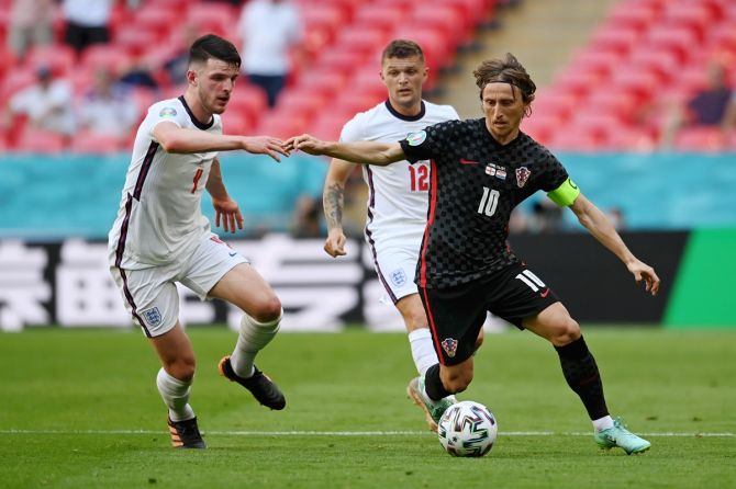 Croatia's Luka Modric is challenged by England's Declan Rice