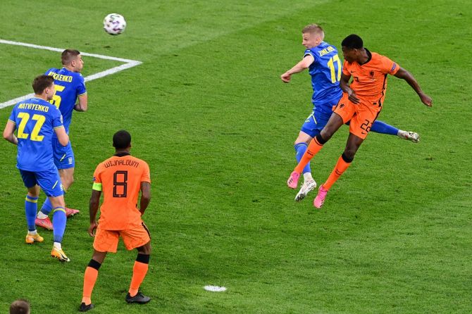 Denzel Dumfries rises above Ukraine defenders to head home the match-winner for the Netherlands.