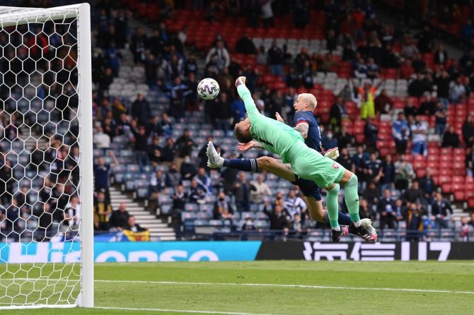 Czech Republic goalkeeper Tomas Vaclik  thwarts Scotland's Lyndon Dykes.