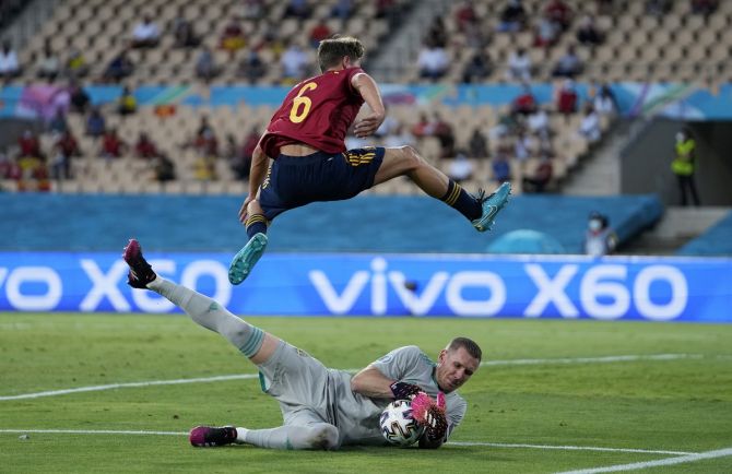 Sweden goalkeeper Robin Olsen thwarts Spain's Marcos Llorente