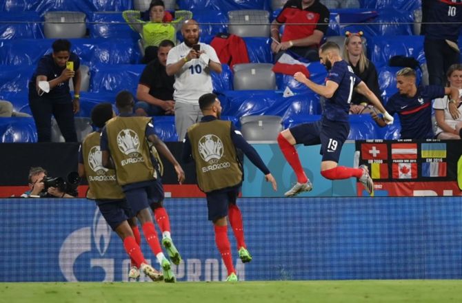 France's Karim Benzema celebrates scoring a goal, which was later disallowed for off-side
