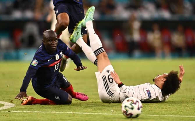 Germany's Leroy Sane makes a rough challenge on France's N'Golo Kante