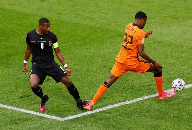 Denzel Dumfries is fouled by Austria's David Alaba, leading to a penalty being awarded to the Netherlands