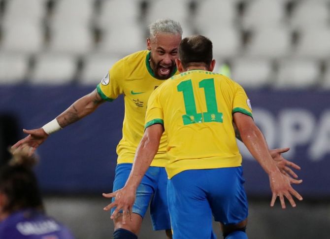 Brazil's Everton Ribeiro and Neymar celebrate a goal