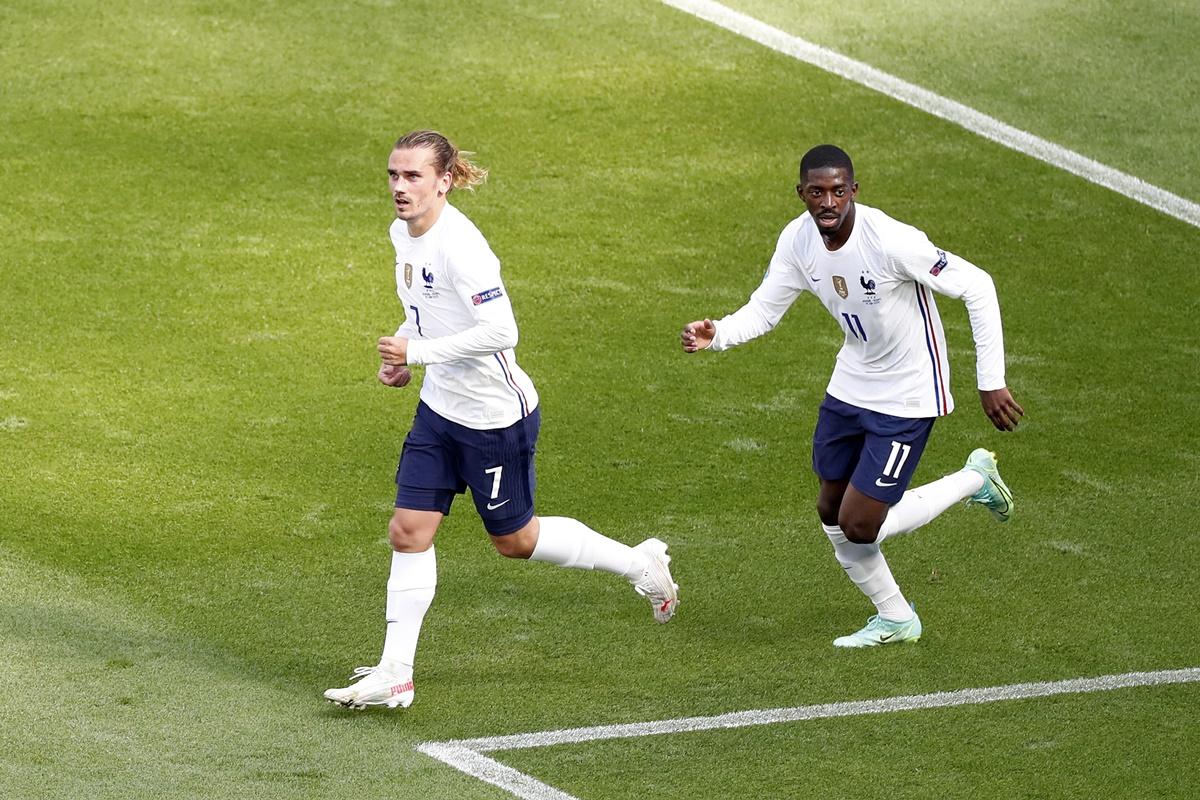 Antoine Griezmann celebrates with Ousmane Dembele after restoring parity for France during the Euro 2020 Group F match against Hungary, at Puskas Arena in Budapest