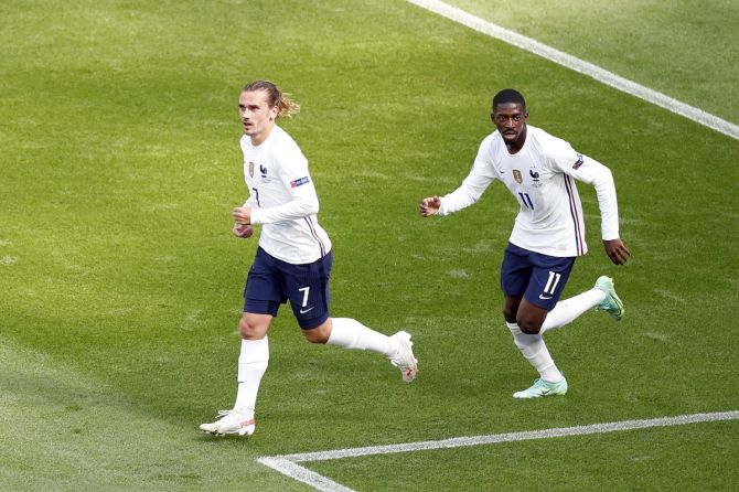 Antoine Griezmann celebrates with Ousmane Dembele after restoring parity for France during the Euro 2020 Group F match against Hungary, at Puskas Arena in Budapest