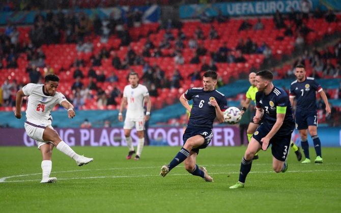 England's Reece James shoots at goal and misses whilst under pressure from Kieran Tierney.
