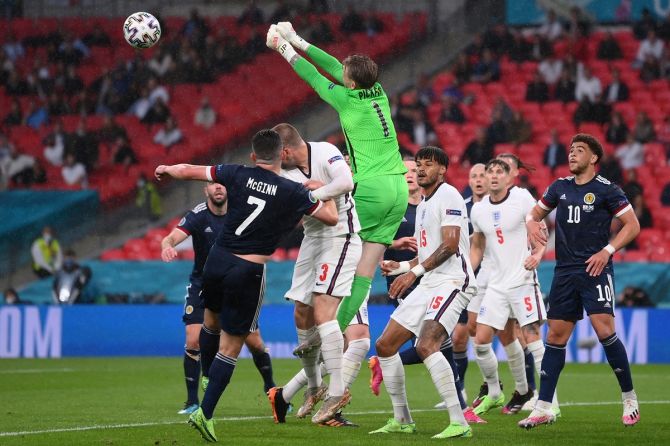 England goalkeeper Jordan Pickford punches the ball clear