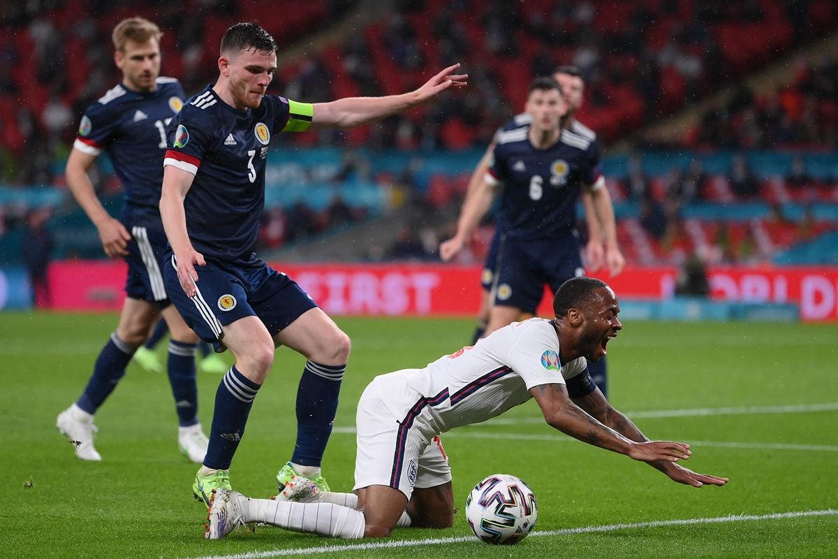 England striker Raheem Sterling is challenged by Scotland's Andrew Robertson during the Euro 2020 Group D match, at Wembley stadium in London, on Friday