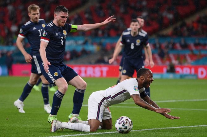 England striker Raheem Sterling is challenged by Scotland's Andrew Robertson during the Euro 2020 Group D match, at Wembley stadium in London, on Friday
