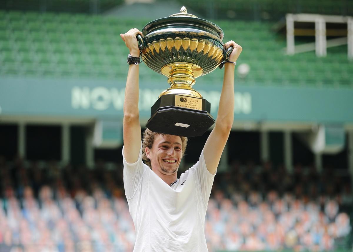 France's Ugo Humbert poses with a trophy after beating Russia's Andrey Rublev in the final of the Halle Open on Sunday. 