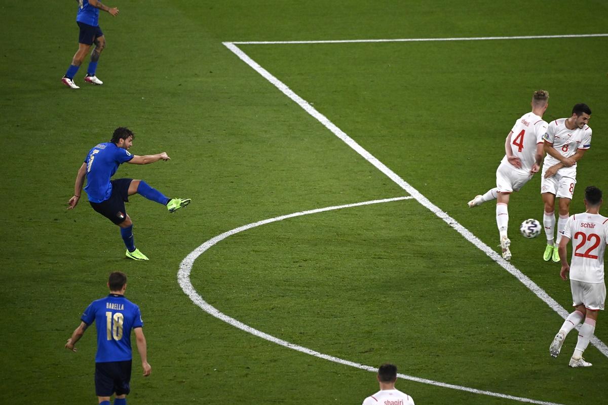 Italy's Manuel Locatelli scores Italy's second goal against Switzerland with a left-footed strike.