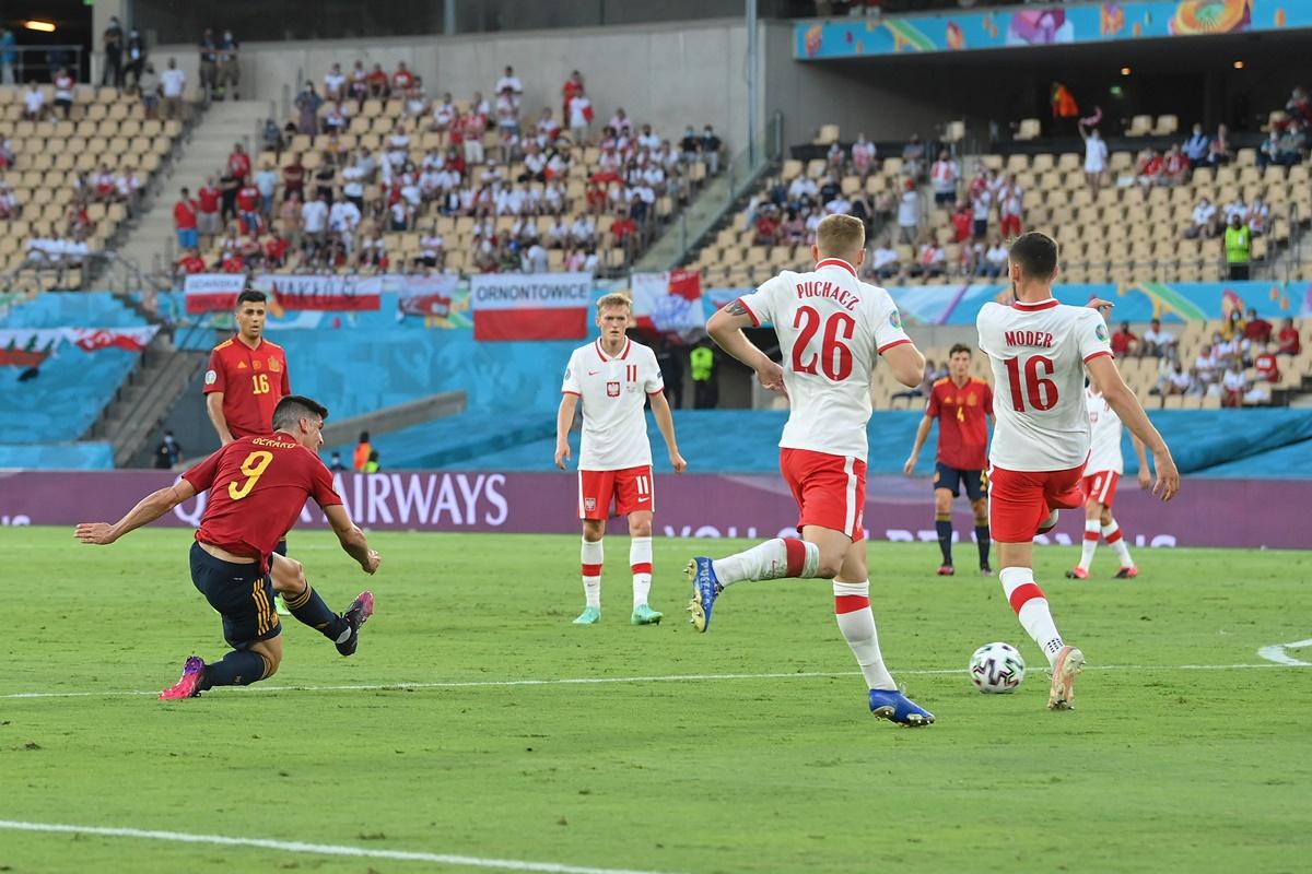 Gerard Moreno crosses the ball leading to Spain's goal, scored by Alvaro Morata (not pictured)