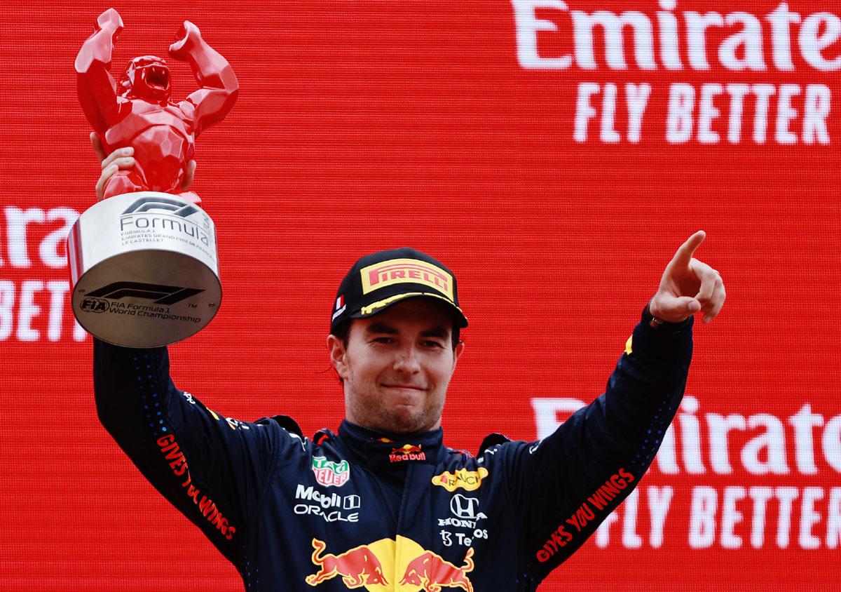 Third placed Sergio Perez of Mexico and Red Bull Racing celebrates on the podium. 