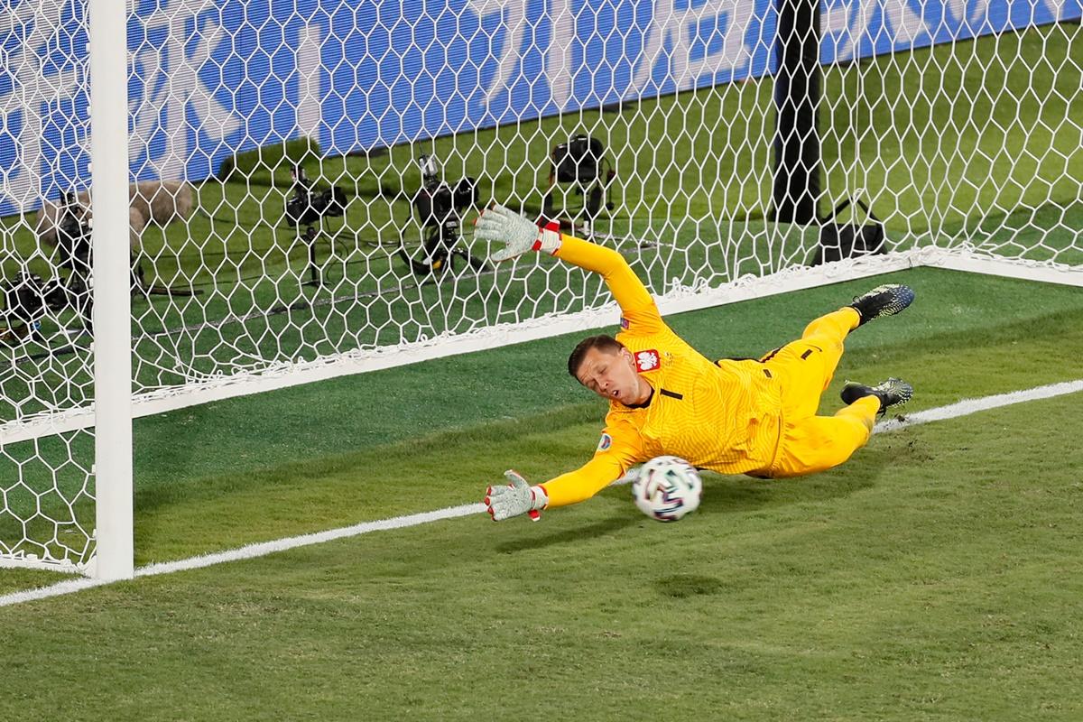 Poland goalkeeper Wojciech Szczesny attempts to save a penalty from Spain's Gerard Moreno (not pictured)