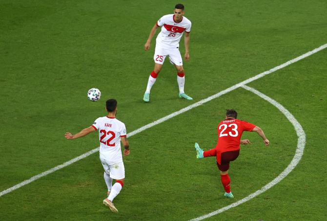 Xherdan Shaqiri curls an exquisite shot beyond the despairing dive of Turkey goalkeeper Ugurcan Cakir to score the Switzerland’s second in the Group A match in Baku