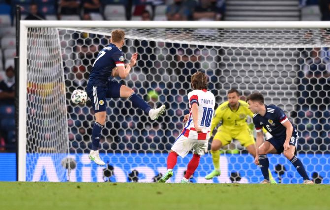 Luka Modric volleys from outside the box to score Croatia's second goal past Scotland goalkeeper David Marshall