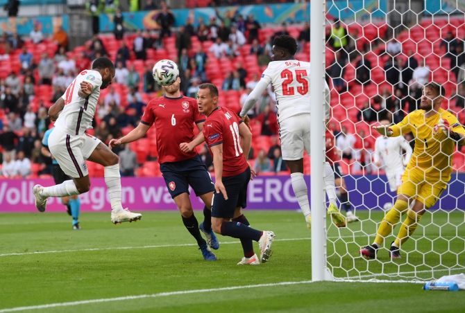 Raheem Sterling puts England ahead with a header during the Euro 2020 Group D match against the Czech Republic, at Wembley Stadium, on Tuesday. 