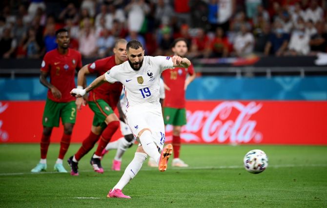 Karim Benzema draws France level from the penalty spot.