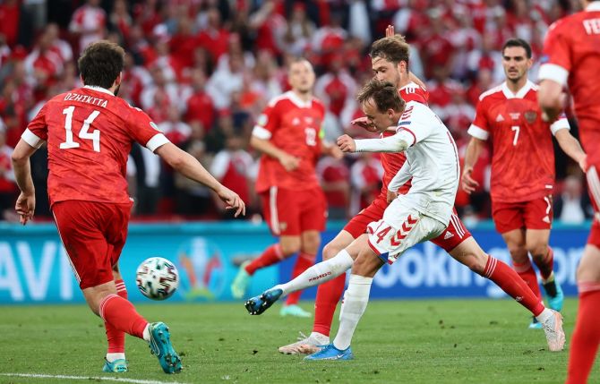 Mikkel Damsgaard scores Denmark's first goal during the Euro 2020 Group B match against Russia, at Parken stadium in Copenhagen.