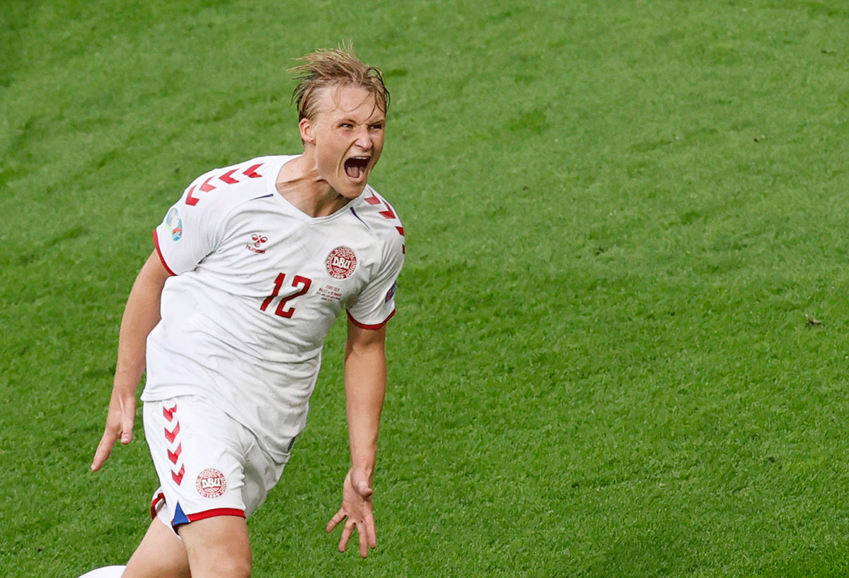 Denmark's Kasper Dolberg celebrates scoring their second goal 