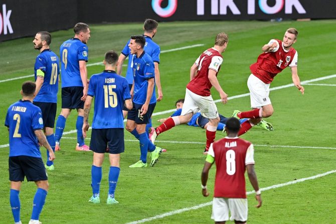 Sasa Kalajdzic celebrates pulling a goal back for Austria