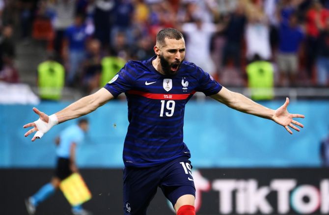 Karim Benzema celebrates after making it 1-1 for France 