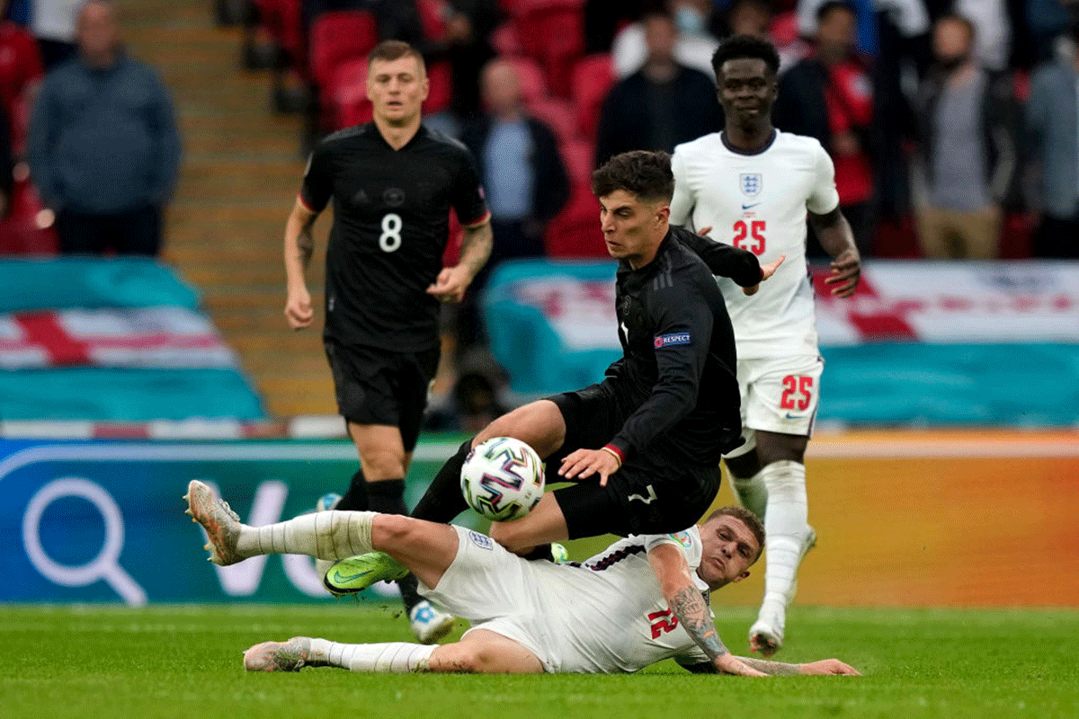 Germany's Kai Havertz is challenged by England's Kieran Trippier 