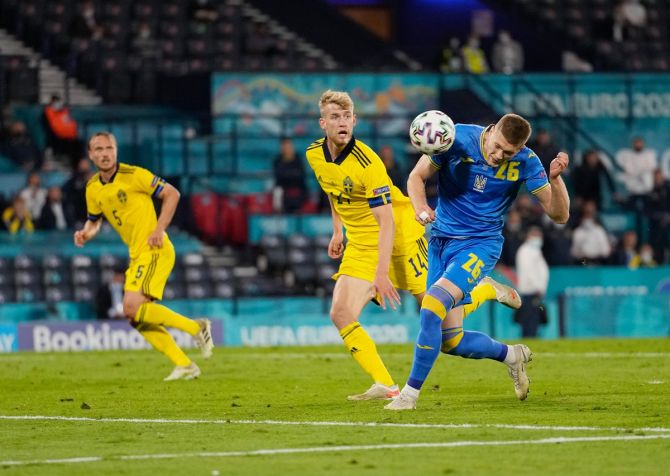 Artem Dovbyk heads the ball into goal in extra-time to score the match-winner for Ukraine in the Euro 2020 Round of 16 match against Sweden, at Hampden Park in Glasgow, Scotland, on Sunday