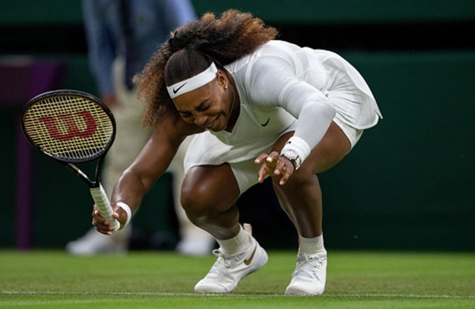  Serena Williams, who had started the match with strapping on her right thigh, then let out a shriek and sank kneeling to the grass sobbing, before being helped off the court.