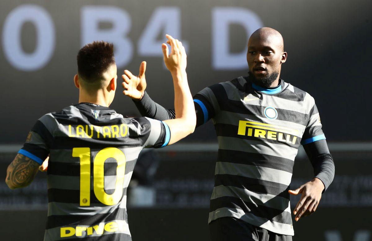 Inter Milan's Romelu Lukaku celebrates with teammate Lautaro Martinez after scoring their first goal against Genoa CFC during ther Serie A match between at Stadio Giuseppe Meazza in Milan on Sunday. 