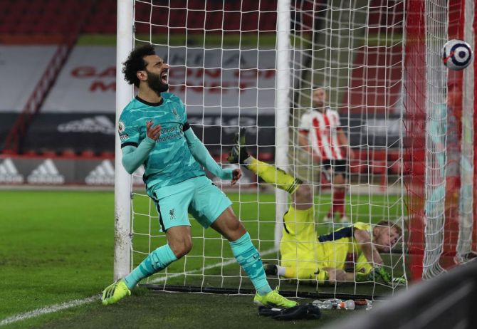 Liverpool's Mohamed Salah reacts after missing a chance during their Premier League match against Sheffield United at Bramall Lane in Sheffield on Sunday.