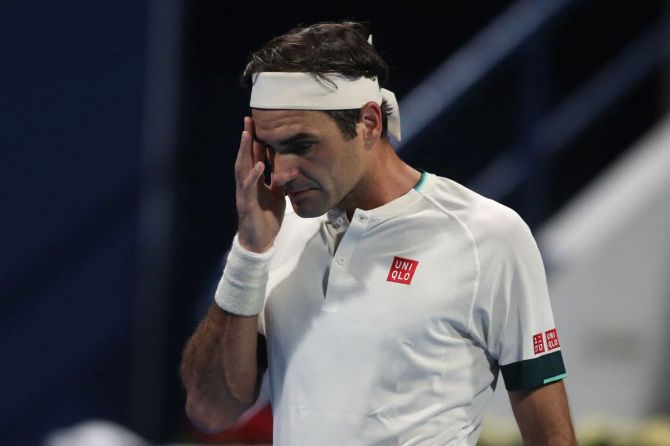 Switzerland's Roger Federer reacts during his quarter-final loss to Georgia's Nikoloz Basilashvili in the Qatar Open at Khalifa International Tennis and Squash Complex in Doha, Qatar, on Thursday