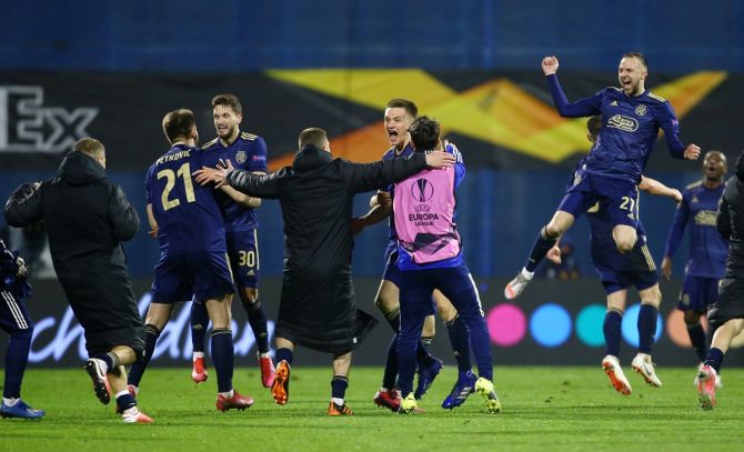 Dinamo Zagreb players celebrate after defeating Tottenham Hotspur in the Europa League Round of 16 Second Leg at Stadion Maksimir, in Zagreb, Croatia, on Thursday