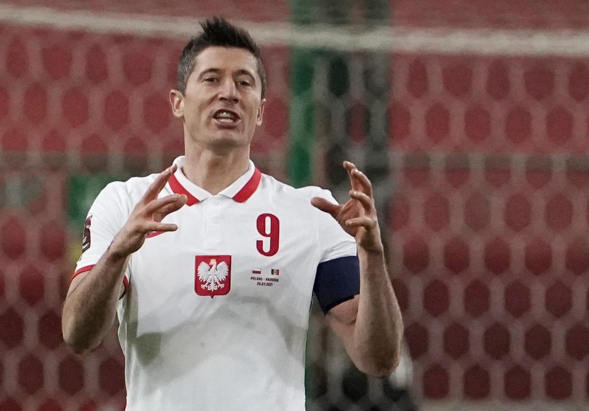 Robert Lewandowski celebrates scoring Poland's second goal against Andorra