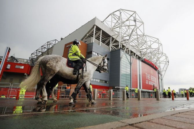 Police officers outside the stadium at Old Trafford before the match between Manchester United and Liverpool on Thursday 
