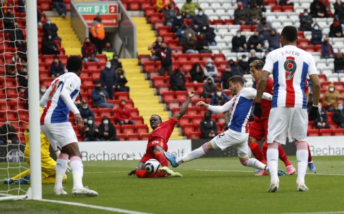 Liverpool's Sadio Mane scores their first goal against Crystal Palace at Anfield on Sunday