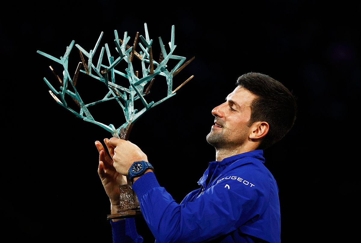 Serbia's Novak Djokovic celebrates winning with the trophy on winning the Paris Masters final against Russia's Daniil Medvedev at Accor Arena, Paris, on Sunday 