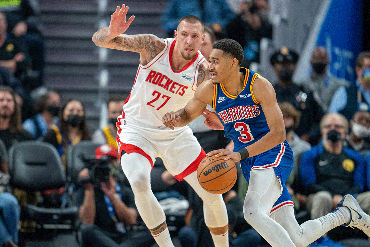 Golden State Warriors guard Jordan Poole (3) drives to the net against Houston Rockets center Daniel Theis (27) during the second quarter of their NBA match at Chase Center in San Francisco, California, on Sunday