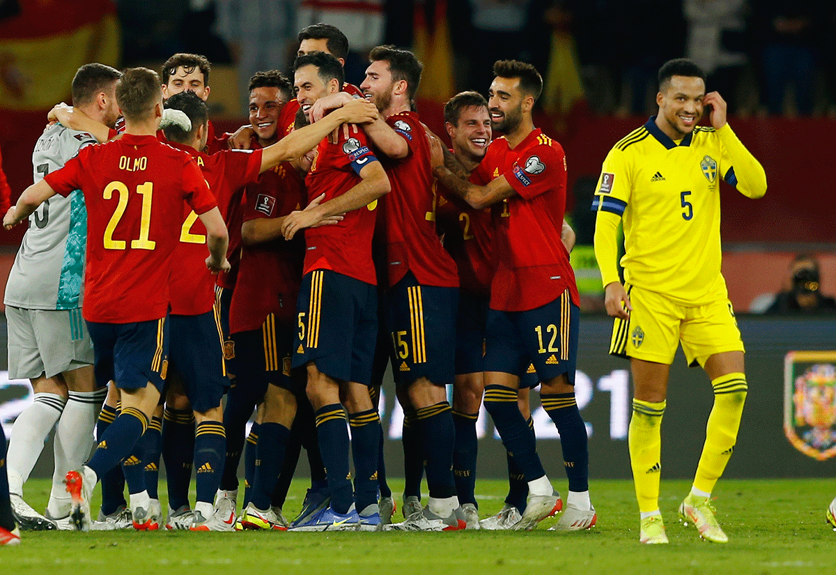 Spain players celebrate after qualifying for the Qatar 2022 World Cup after defeating Sweden during the World Cup qualifiers at Estadio de La Cartuja, Seville, on Sunday 