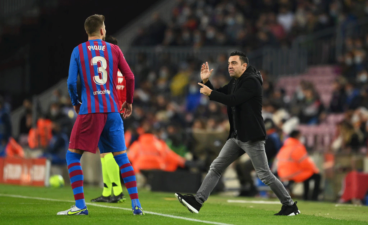 Head Coach of FC Barcelona Xavi Hernandez remonstrates with Gerard Pique on the sidelines during the La Liga Santander match against RCD Espanyol at Camp Nou in Barcelona on Saturday 