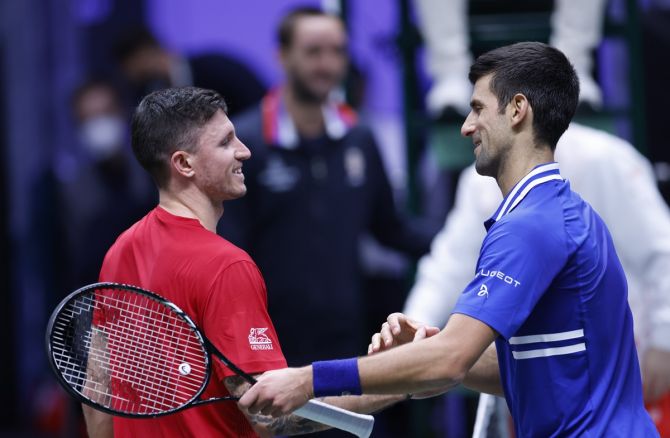 Serbia's Novak Djokovic and Austria's Dennis Novak meet at the net after their match in the Davis Cup Finals Group F match, at Olympiahalle, Innsbruck, Austria, on Friday.