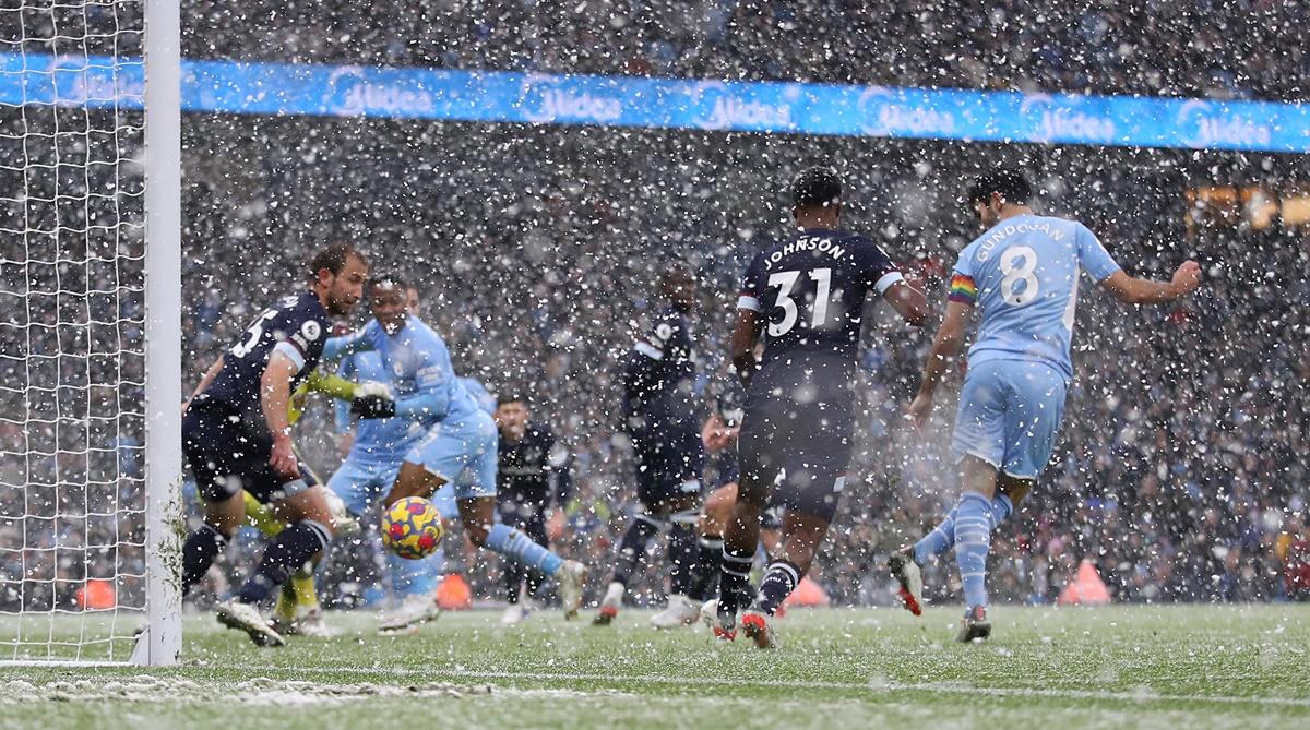 Ilkay Gundogan scores Manchester City's first goal against West Ham United, at Etihad stadium, in Manchester.