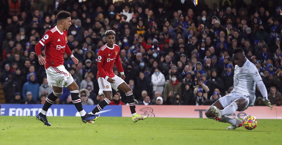 Jadon Sancho scores to put Manchester United ahead in the Premier League match against Chelsea, at Stamford Bridge, in London, on Sunday.