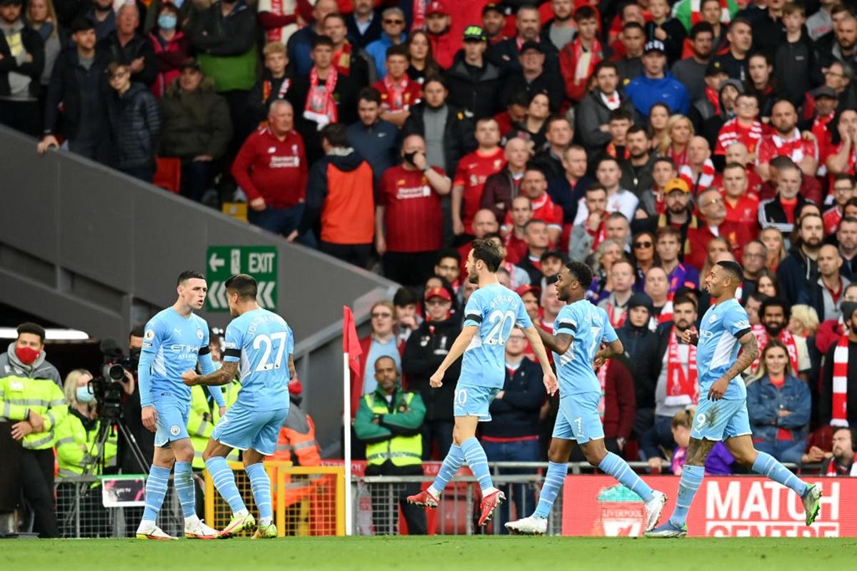 Phil Foden, left, celebrates with teammates after restoring  parity for Manchester City.