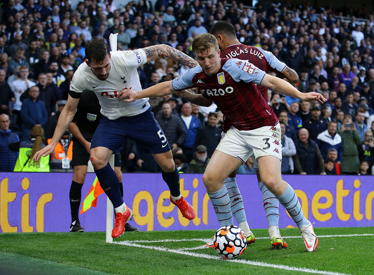 Tottenham Hotspur's Pierre-Emile Hojbjerg and with Aston Villa's Matt Targett vie for the ball 