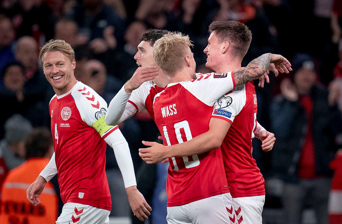 Denmark's Joakim Maehle celebrates scoring their first goal with Simon Kjaer, Andreas Christensen and Daniel Wass Liselotte against Austria at Parken Stadium in Copenhagen, Demmark