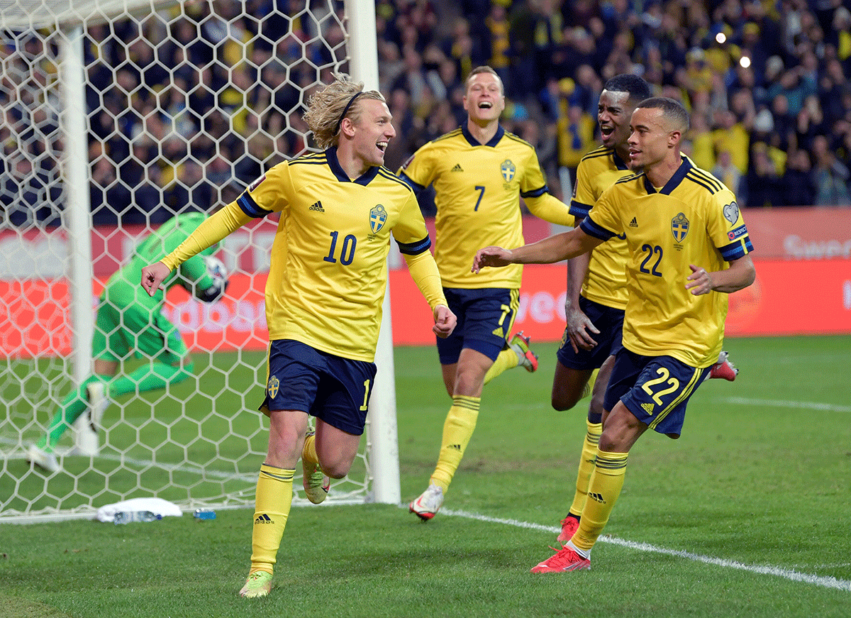 Sweden's Emil Forsberg celebrates scoring their first goal with teammates